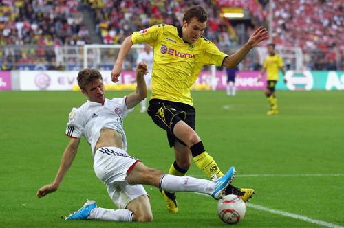 Kevin Grosskreutz și Thomas Muller, într-un „Der Klassiker” din 2010 // FOTO: Getty Images