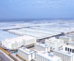 Se ridică mega-fabrica misterioasă a Chinei! O fortăreață mai mare decât orașul San Francisco: 1 milion de mașini, un stadion și un coșmar pentru Tesla