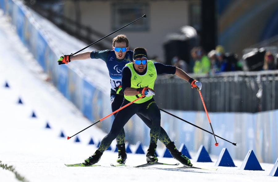Maksym Murashkovskyi alături de Vitaliy Trush în cursă FOTO Guliver/GettyImages A folosit ChatGPT drept antrenor timp de șase luni și a câștigat o medalie la Jocurile Paralimpice