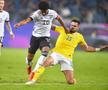 Andrei Burcă îl blochează pe Serge Gnabry în Germania - România 2-1