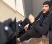 Cristi Tănase, întins pe jos, cu sânge la gură și incoerent în holul blocului // sursă foto: 7est.ro