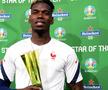 Paul Pogba și trofeul oferit pentru omul meciului Franța - Germania