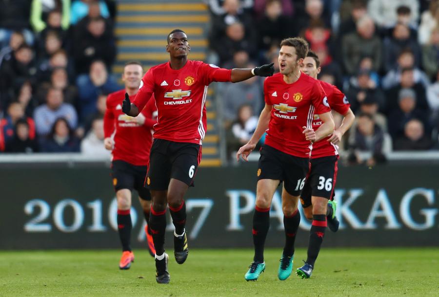 Paul Pogba și Michael Carrick, în tricoul lui Manchester United // FOTO Getty Images Paul Pogba face o predicție curajoasă despre Manchester United: „Dacă Arsenal poate fi campioană, atunci și ei pot”