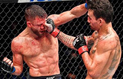 VIDEO + FOTO Luptă istorică în UFC! Max Holloway și-a umplut de sânge adversarul: 141 de lovituri într-o singură rundă! Cum l-a umilit în final