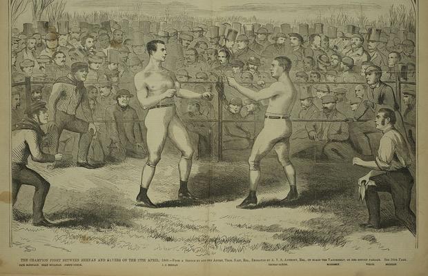 162 de ani de la primul meci de box pentru titlul mondial. Un englez și un american s-au măcelărit 42 de reprize, sub privirile lui Charles Dickens și ale unor capete încoronate, deși lupta a fost ilegală