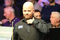 Luca Brecel, deținătorul titlului, a fost eliminat într-un mod incredibil în primul tur al Campionatului Mondial de Snooker