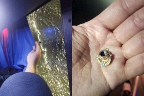 Dovezi ale atacului: un geam spart al autocarului și un glonț turtit