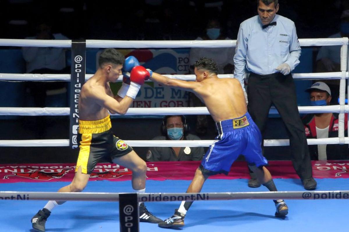 GALERIE FOTO Box în vremea pandemiei » Pugiliști stropiți cu dezinfectant înaintea luptelor și spectatori distanțați