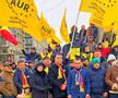 Ciprian Paraschiv, cu palton negru și eșarfă tricoloră la gât, la acțiunile AUR Iași / Sursă foto: Facebook