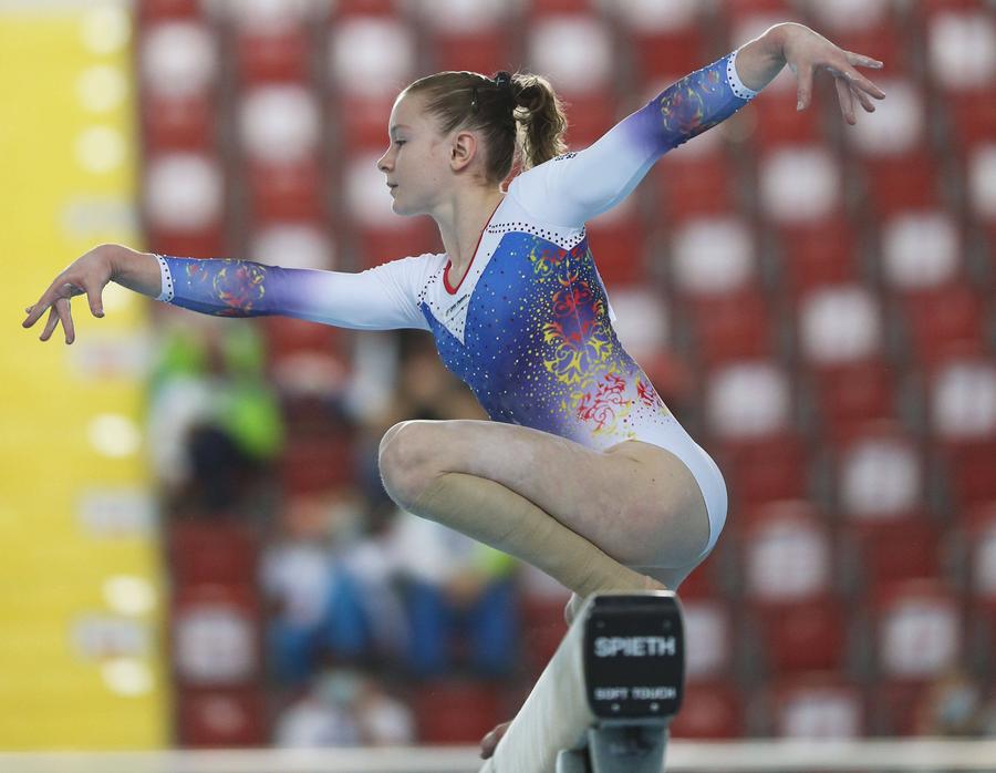 Iulia Trestianu concurând la bârnă FOTO Imago-Images Antrenoarea care i-a ghidat primii pași în performanță gimnastei Ana Maria Bărbosu: „Gimnastica e o minune, iar fetele sunt niște minuni și mai mari!”