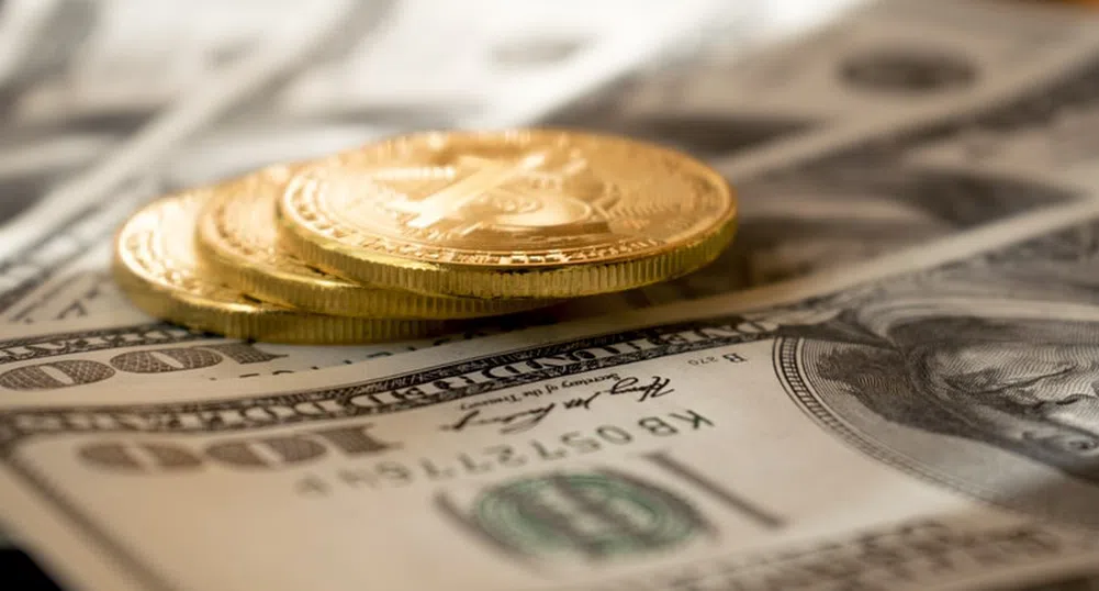 Цената на златото падна до петседмичен минимум, доларът поскъпва
