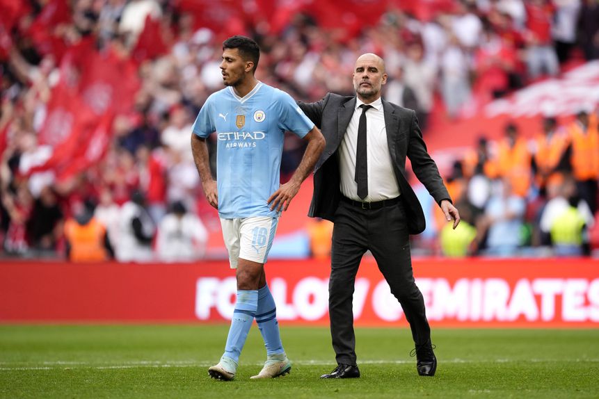 Rodri e Guardiola no relvado
