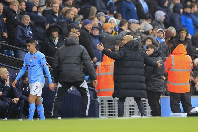 Pep Guardiola e João Cancelo - Foto: IMAGO