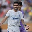 Rúben Neves a sorrir com a camisola do Al Hilal