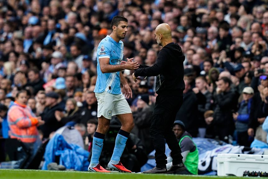 Rodri e Pep Guardiola
