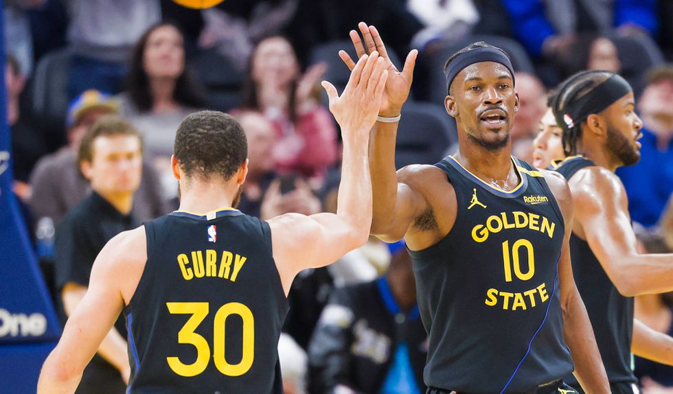 Steph Curry e Jimmy Butler pelos Golden State Warriors
