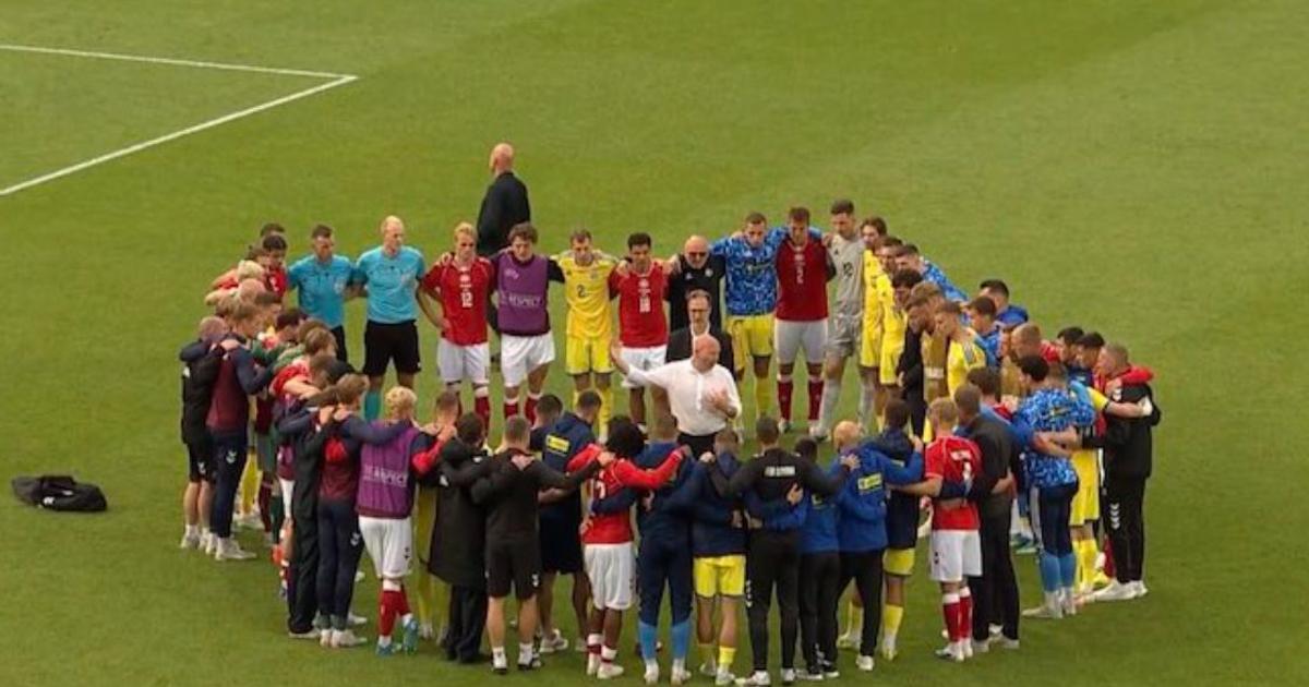 Imagem poderosa: susto com Eriksen une equipas de Dinamarca 