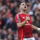 Diogo Dalot bate no peito depois de o Man. United marcar um golo ao Arsenal