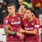 Jogadores da Roma a festejar