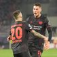 Patrik Schick celebra com Grimaldo golo do Leverkusen na casa do Olympiakos (IMAGO)