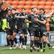 Jogadores do Wrexham a celebrarem o primeiro golo do jogo, de McClean