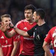 Maguire protesta penálti assinalado contra o Manchester United, no reduto do Everton, e depois revertido (IMAGO)