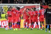 PSG festeja um dos golos diante do Bayer Leverkusen