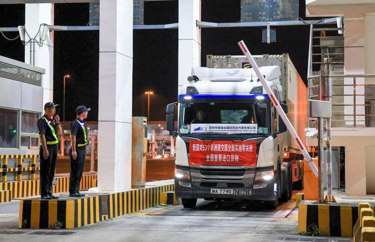 A container truck, transporting the first batch of imports under the expanded zero-tariff treatment to all 53 African nations, enters Shenzhenwan Port at midnight in Shenzhen, south China's Guangdong Province, May 1, 2026. (Xinhua/Mao Siqian)