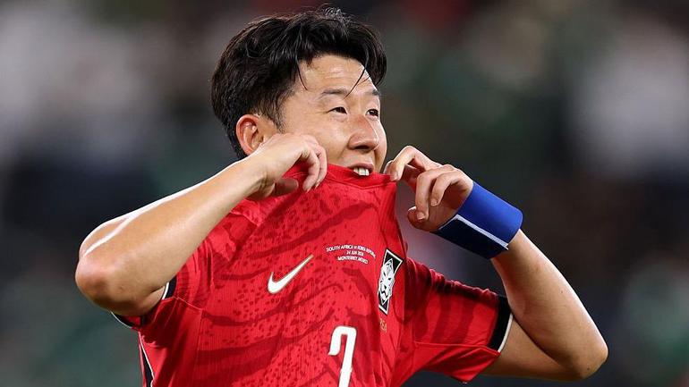 Son Heung-min bites his shirt after South Korea lose to South Africa and are knocked out of the 2026 World Cup | Photo via Getty Images