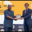 Ambassador Frederik Landshöft presents President John Dramani Mahama with a catalogue documenting provenance research on four cultural objects from Kpando, including two war drums and two war horns.