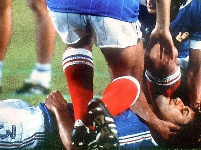 Toni Schumacher jumps at French player Patrick Battiston, who lost three teeth and suffered a concussion. Photograph: dpa/Corbis
