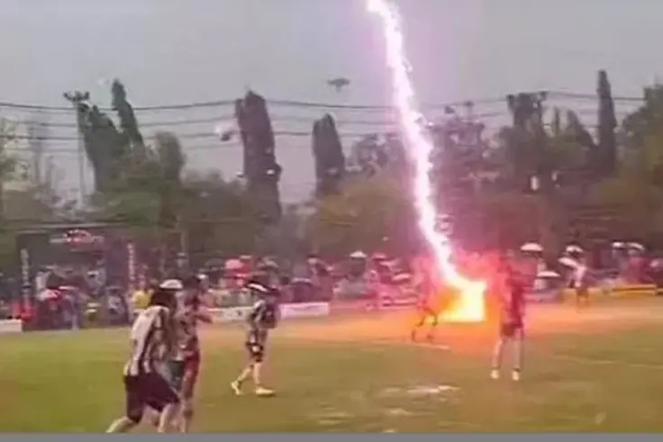 Footballer killed by lightning strike during match in Thailand as 12 others injured