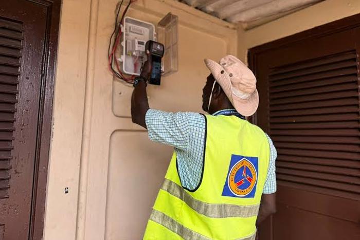 An ECG officer installing a meter