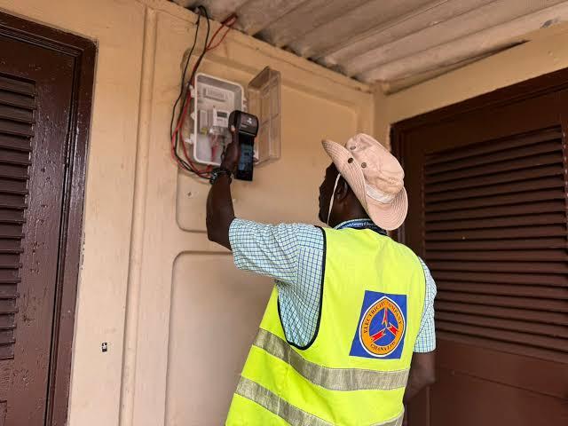 An ECG officer installing a meter