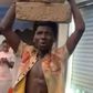 Madina residents make alleged thief carry loads of cement blocks on his head as punishment