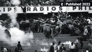 People fleeing tear gas at the Estadio Nacional in Lima on May 24, 1964.Credit...El Comercio, via Associated Press