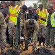 Pres. Mahama clears choked gutter at Tse Addo as he joins national clean-up exercise (video)