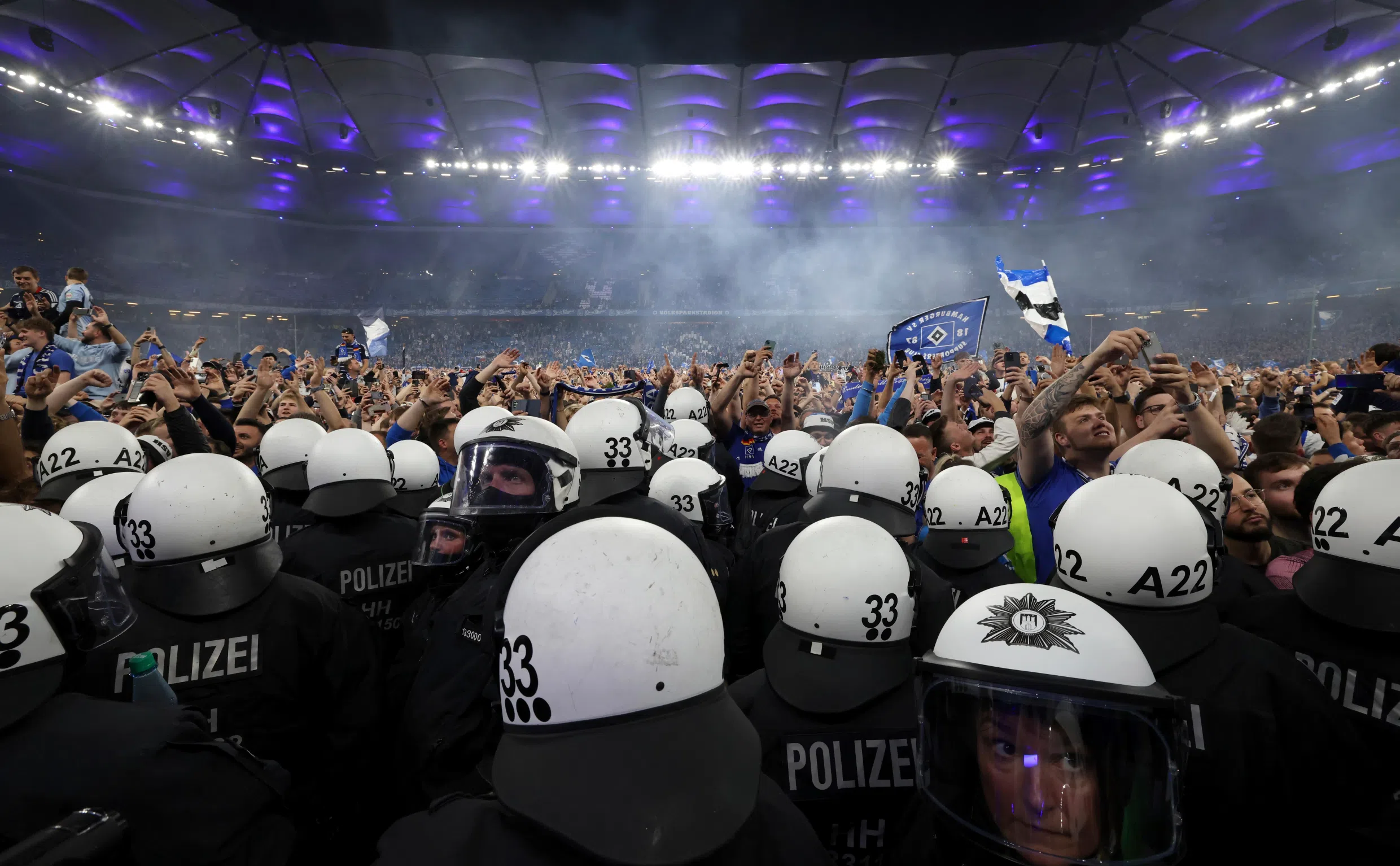 Wild stadium invasion leaves 25 fans seriously injured after police clash (Video)