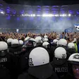 Wild stadium invasion leaves 25 fans seriously injured after police clash (Video)