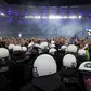 Wild stadium invasion leaves 25 fans seriously injured after police clash (Video)