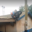 Rider feared dead after accident at Kasoa-Ofankor, motorbike lands on rooftop [video]