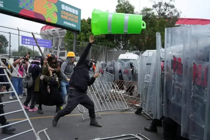 Protesters, police clash outside stadium before Mexico's victory over South Africa