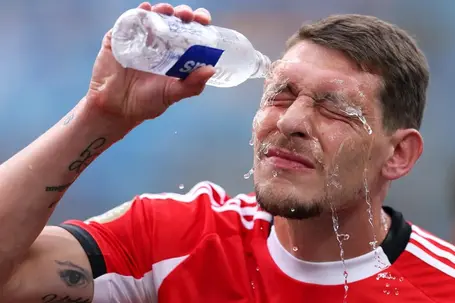 Belotti #19 of SL Benfica pours water on his face during the FIFA Club World Cup 2025 round of 16 match between SL Benfica and Chelsea FC at Bank of America Stadium (Photo by Justin Setterfield - FIFA/FIFA via Getty Images)