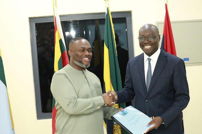 Kenneth Gilbert Adjei (left) and Finance Minister, Ato Forson (right) during the handing over