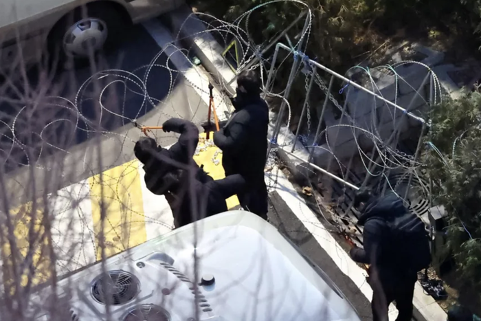 Investigators scale walls, cut barbed wire, arrest South Korea’s President