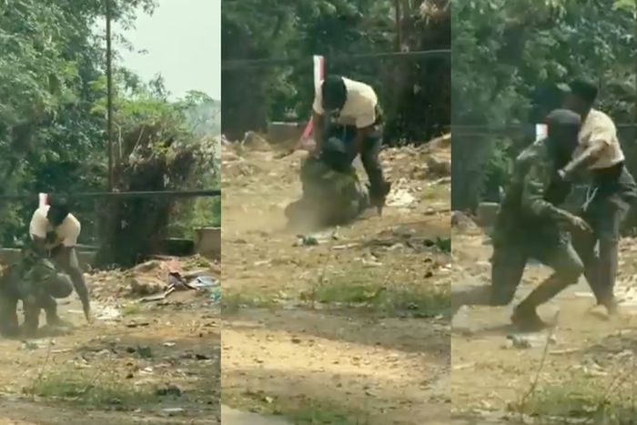 Soldier struggles for freedom as civilian pins him to the ground during scuffle (video)