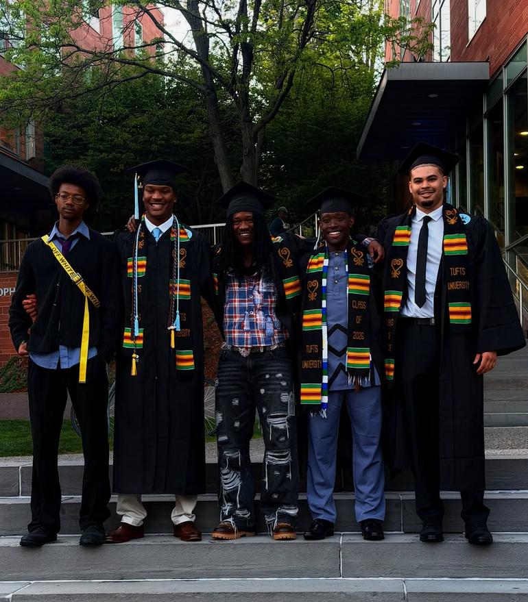 Image of Abraham Attah celebrating the achievement with schoolmates