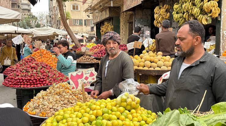 Vendors line up at a popular market in Cairo, Egypt, Tuesday, March 12, 2026. (AP Photo/Amr Nabil)
