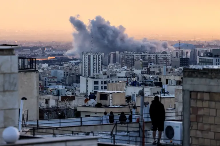Plume of smoke rising from the Iranian capital, Tehran, from U.S.-Israeli strikes on March 3, 2026.
© Atta Kenare—AFP/Getty Images