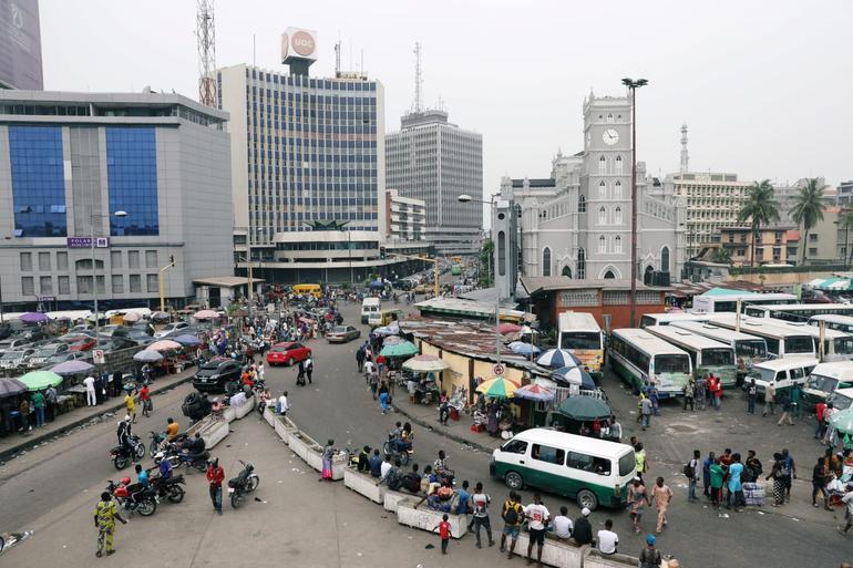 People move on a street of Marina in Victoria Island, Lagos, Nigeria. Temilade Adelaja/Reuters
